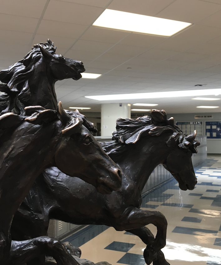 The mustang statue by the freshman locker area.
