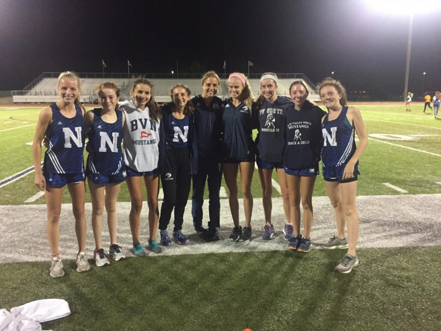 Varsity girls cross country finish second place at the the Olathe North Twilight Meet as a team.