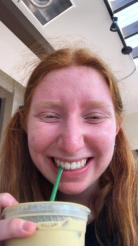 Staff writer Caroline Haines enjoying a delicious iced latte at Martin CIty Coffee. Photo by Caroline Haines.